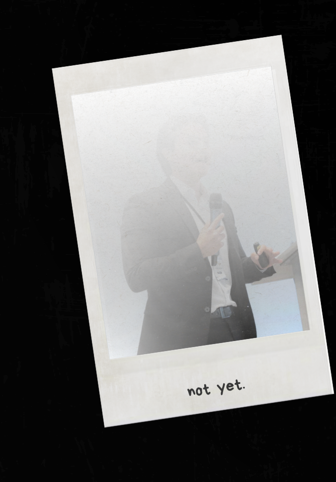 A faded photograph of Imanol Galván presenting, tucked inside a Polaroid frame captioned "not yet."